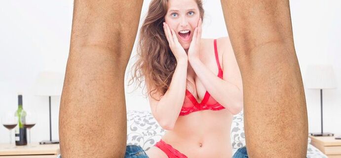 woman surprised by the increased size of the male penis photo 2